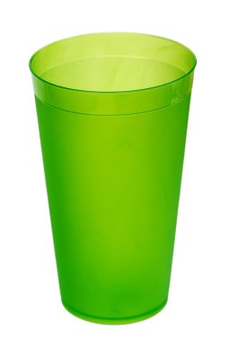 Green plastic glass for juice, isolated on white background.